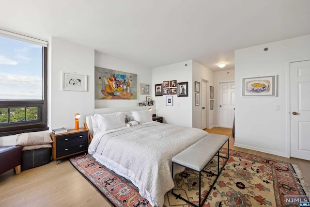 bedroom with light hardwood / wood-style flooring