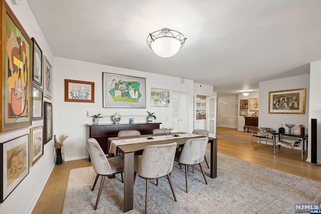 dining space featuring light hardwood / wood-style flooring