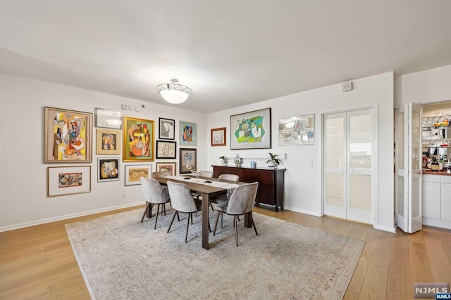 dining room featuring light hardwood / wood-style flooring