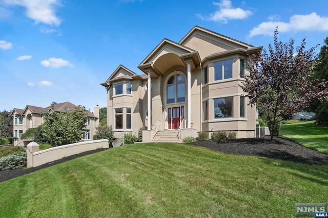 view of front of house with a front lawn