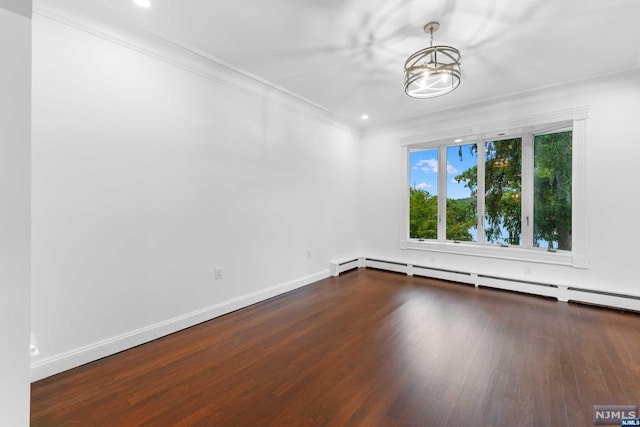 empty room featuring a notable chandelier, dark wood-type flooring, a baseboard heating unit, and ornamental molding