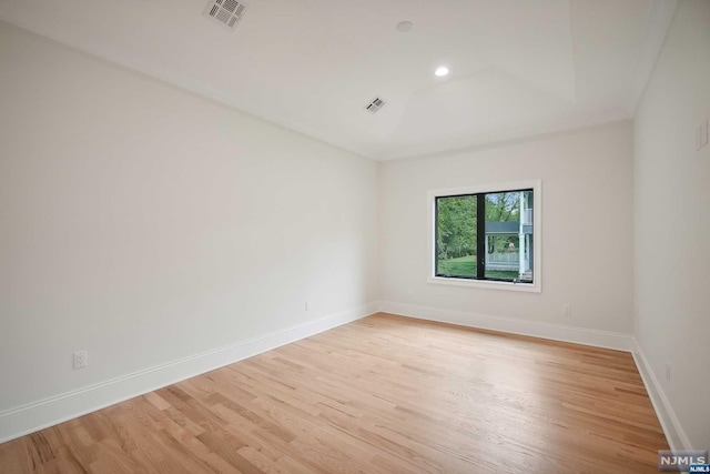 unfurnished room featuring light hardwood / wood-style floors