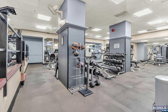 workout area with a drop ceiling