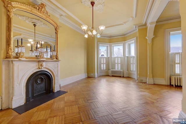 unfurnished living room featuring light parquet flooring, radiator, and ornamental molding