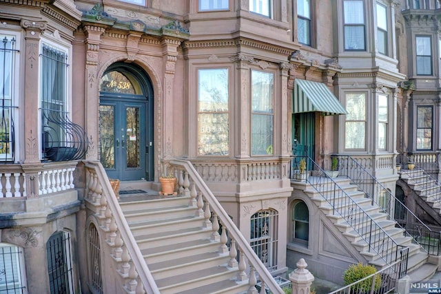 view of exterior entry featuring french doors