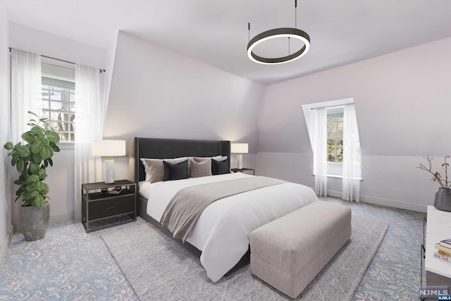 bedroom featuring lofted ceiling