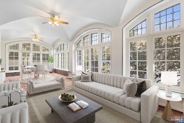 sunroom / solarium with vaulted ceiling and ceiling fan