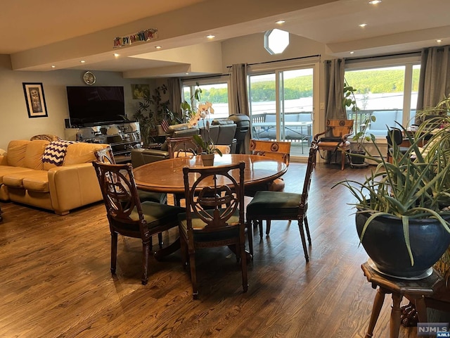 dining space with wood-type flooring