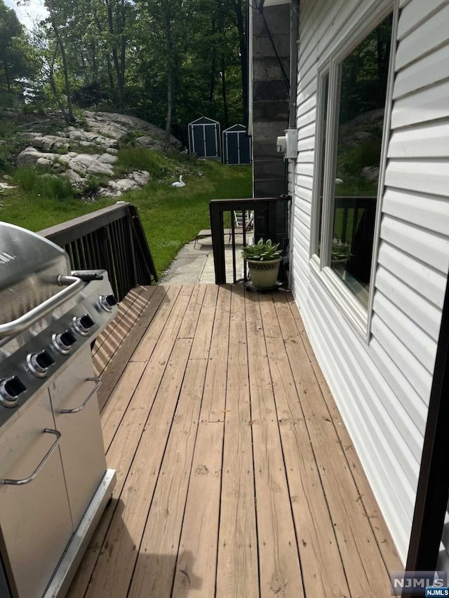 wooden deck with a yard