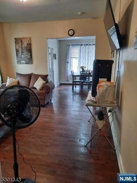 living room featuring dark hardwood / wood-style floors