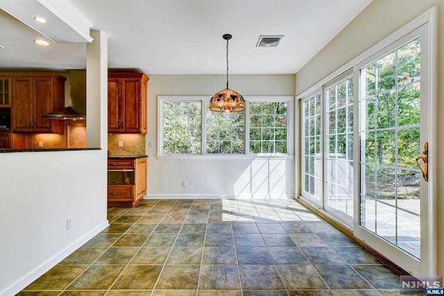 interior space with a chandelier and plenty of natural light