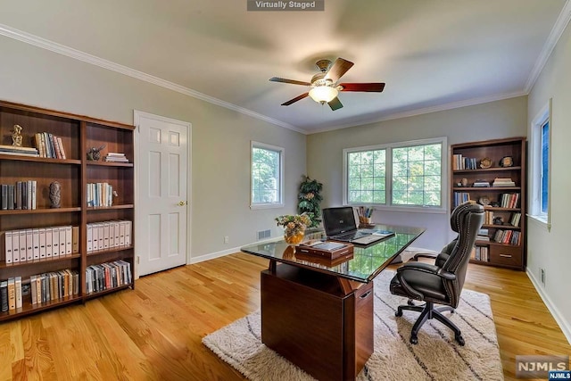 home office with ceiling fan, light hardwood / wood-style floors, and ornamental molding