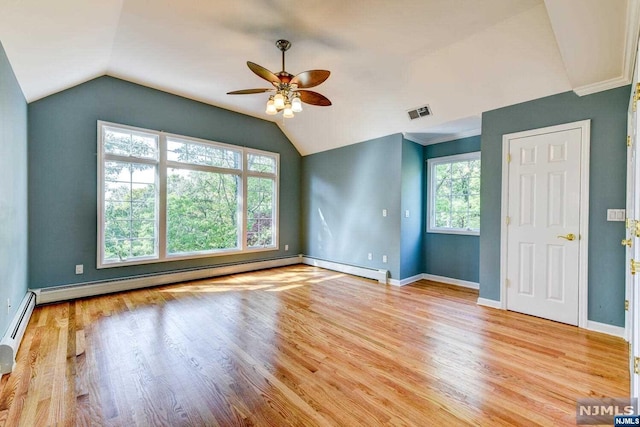 empty room featuring light hardwood / wood-style floors, a wealth of natural light, and ceiling fan