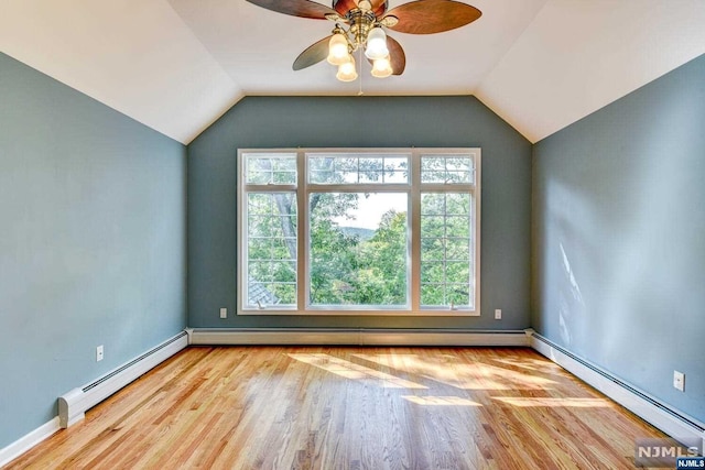 unfurnished room featuring ceiling fan, a baseboard radiator, and light wood-type flooring