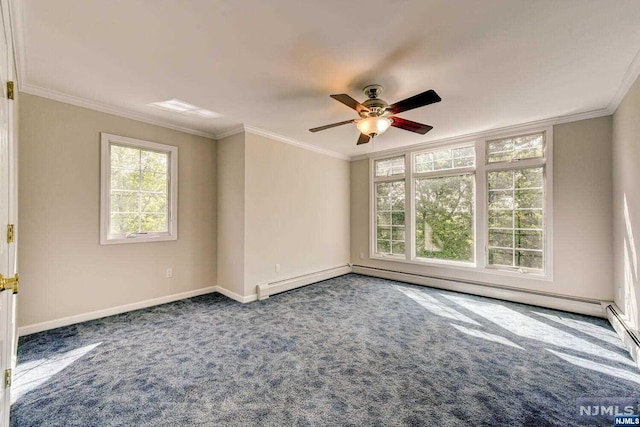 spare room with dark colored carpet, ceiling fan, and crown molding