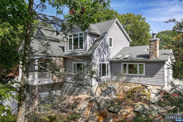 view of front of property with a balcony