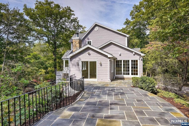 rear view of house featuring a patio