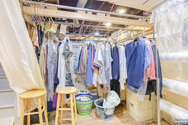 walk in closet featuring hardwood / wood-style flooring