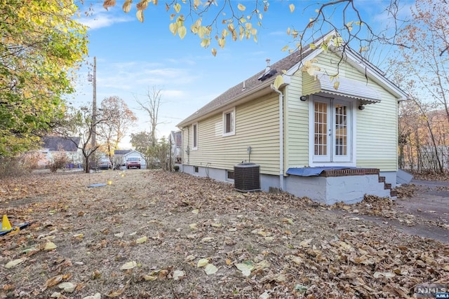 view of home's exterior with central AC unit