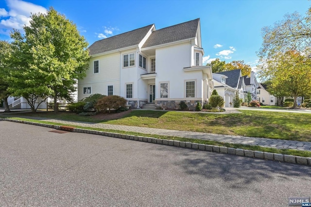 view of front of property with a front lawn