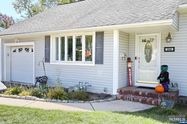 property entrance with a garage