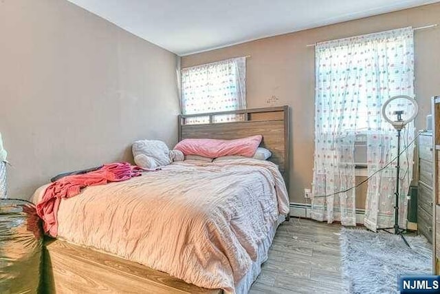 bedroom featuring hardwood / wood-style flooring