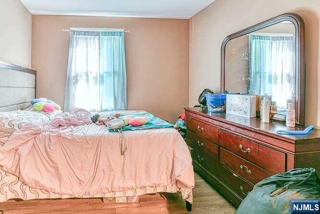 bedroom with light wood-type flooring