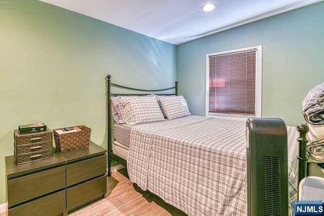 bedroom with light hardwood / wood-style floors