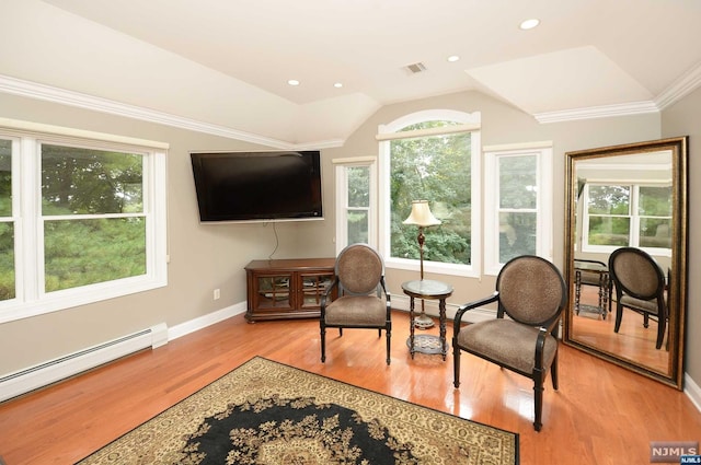 living area featuring a baseboard heating unit, ornamental molding, light hardwood / wood-style flooring, and vaulted ceiling