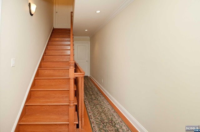 staircase with ornamental molding