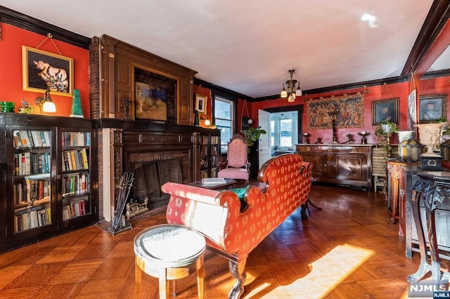 living room with ornamental molding, parquet flooring, and a brick fireplace