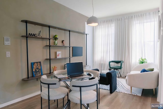 office area with a healthy amount of sunlight and hardwood / wood-style floors