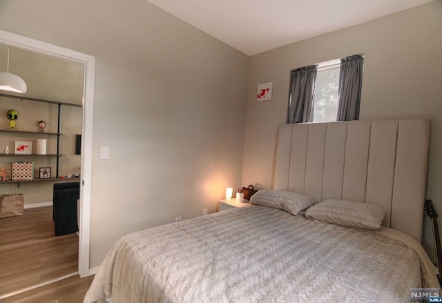 bedroom featuring hardwood / wood-style flooring