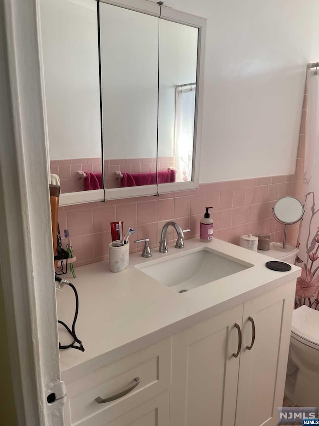 bathroom with vanity and toilet