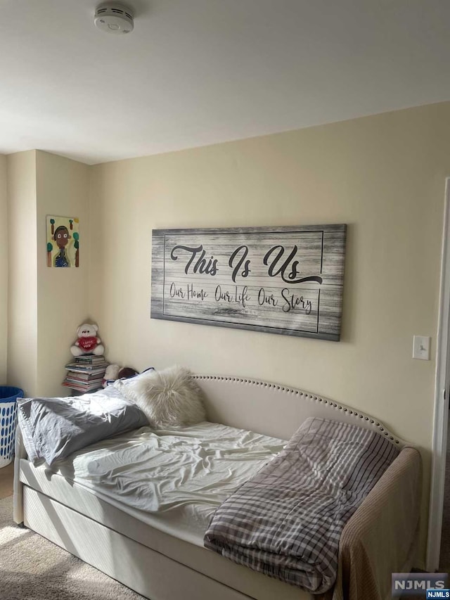 bedroom featuring carpet