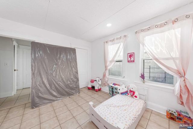 playroom with light tile patterned flooring