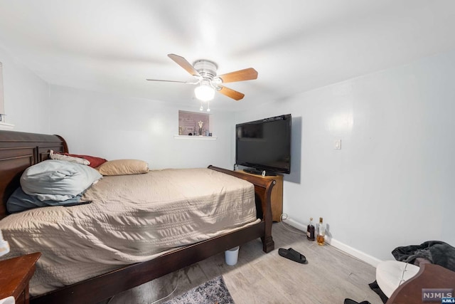 bedroom featuring ceiling fan and light wood-type flooring