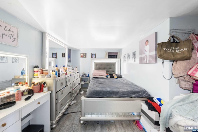 bedroom featuring dark hardwood / wood-style flooring