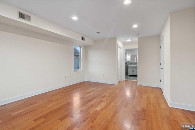 unfurnished living room featuring light hardwood / wood-style floors