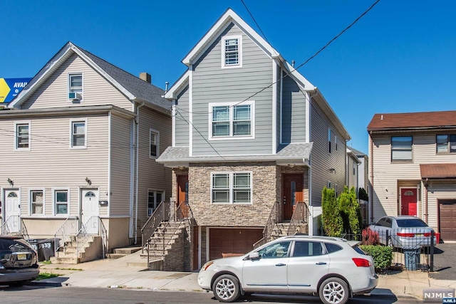 front of property with a garage