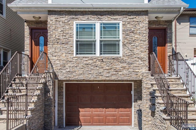 view of front of property with a garage