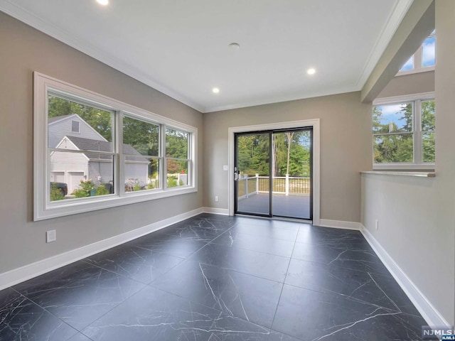 unfurnished room featuring crown molding