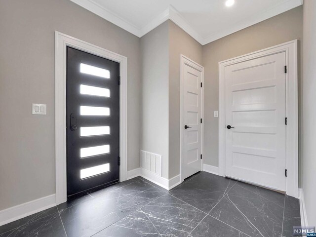 foyer with crown molding