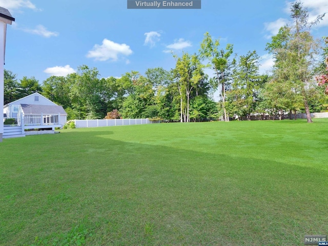 view of yard featuring a wooden deck