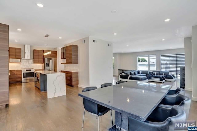 dining room with light wood-type flooring