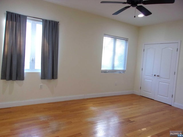 unfurnished bedroom featuring light wood-style floors, ceiling fan, baseboards, and recessed lighting