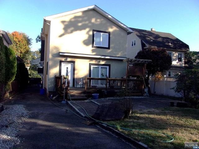 exterior space featuring a deck and fence