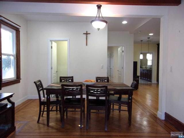 dining room with recessed lighting and baseboards