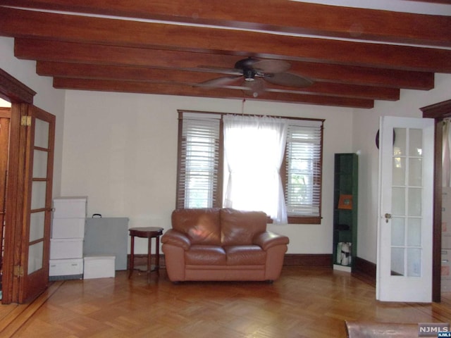 living room featuring ceiling fan, french doors, beamed ceiling, and baseboards