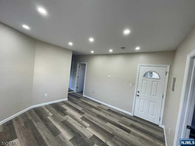 entrance foyer with dark hardwood / wood-style flooring